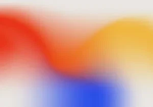 Abstrakte Farbverläufe in Rot, Orange, Gelb und Blau auf einem hellen Hintergrund, die eine dynamische und moderne Ästhetik erzeugen.