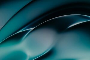 Abstrakte Hintergründe in Blau- und Grüntönen mit geschwungenen Linien und sanften Lichtreflexionen. Ideal für kreative Designprojekte oder als digitale Tapete.