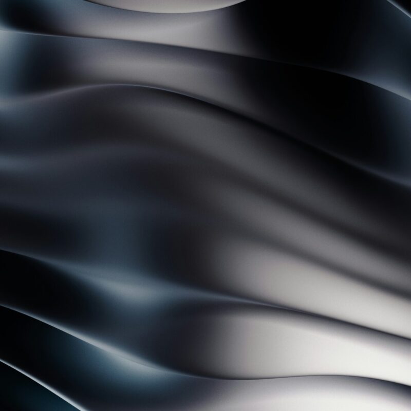 Abstrakte Wellenstruktur in Schwarz und Grau, die eine moderne und elegante Textur darstellt. Ideal für Hintergründe oder Designprojekte.