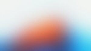 Unschärfe von orangefarbenen und blauen Farbtönen, die eine abstrakte Komposition bilden. Ideal für kreative Projekte und moderne Designs.