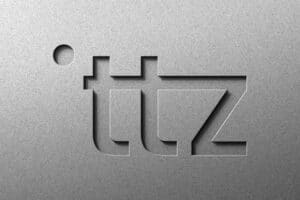 Logo von itz mit modernem, graviertem Design auf silbernem Hintergrund.