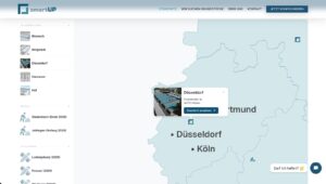 Karte von Nordrhein-Westfalen mit markierten Städten wie Düsseldorf und Köln sowie einem hervorgehobenen Standort.