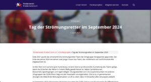 Gruppenfoto von Strömungsrettern bei einer Übung im September 2023, die ihre Rettungsfähigkeiten im Wasser demonstrieren.
