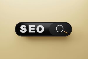 Schaltfläche mit dem Text "SEO" und einer Lupe auf einem goldenen Hintergrund, symbolisiert Suchmaschinenoptimierung und digitale Sichtbarkeit.